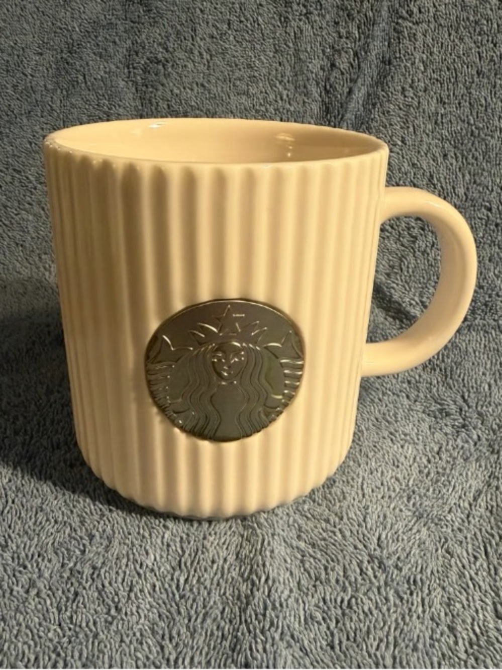 Cream Ribbed Ceramic Mug with Silver Medallion